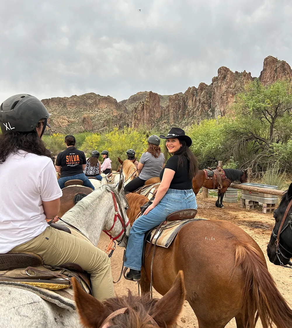 Beets team on a horseback riding outing in the desert