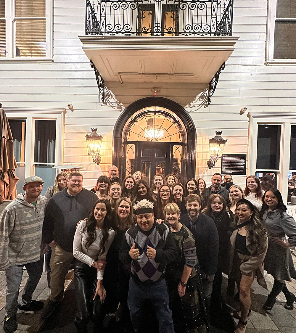 Beets Hospitality team group photo on the front steps of a building